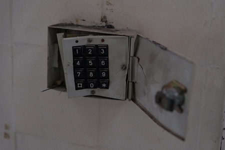 Broken home alarm system with destroyed keypad.の写真素材