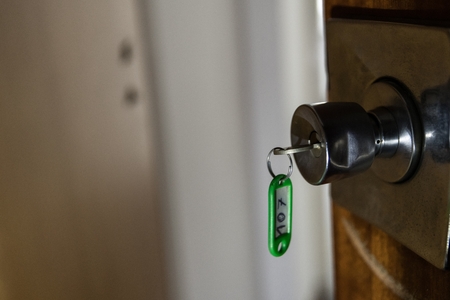Old hotel doors with key and room num