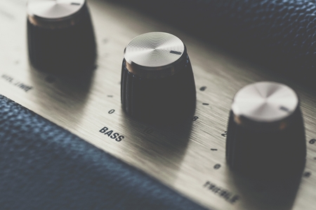 Bass control knob on music amplifier equalizerの写真素材