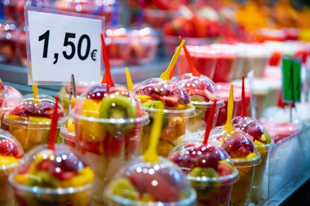 Healthy takeaway lunch. Fruits in plastic cups for snack to goの写真素材