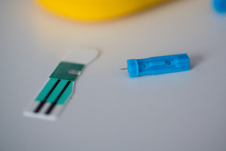 Blood test strip and lancet for glucose self test and urinal acid in blood testの写真素材