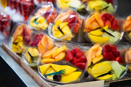 Fresh fruits snacks on market stall for saleの写真素材