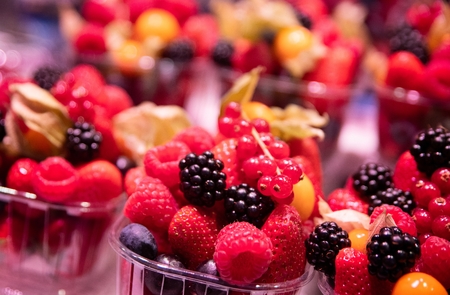 Healthy fruit lunch takeaway. Fresh fruits in plastic basketの写真素材