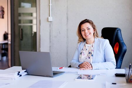 40 years old woman clerk working in the officeの写真素材
