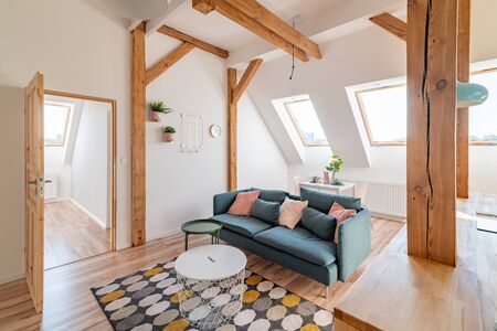 Bright attic living room in the loft apartmentの写真素材