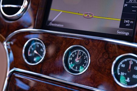 Car analog clock in dashboard. Modern luxury car interiorの写真素材