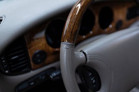 Damaged leather steering wheel. Luxury car renovationの写真素材