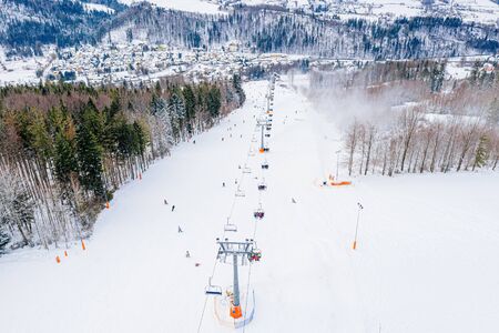 Drone view on ski slope in Polish Beskid mountains. Winter sportsの写真素材