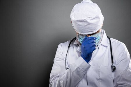 Overworked tired doctor during coronavirus covid-19 epidemic