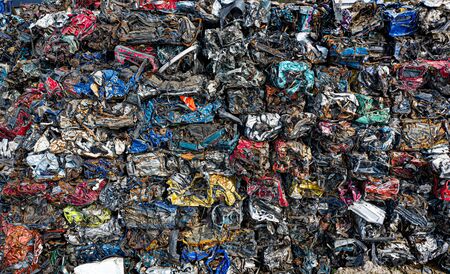 Smashed destroyed car wrecks on car junkyard.