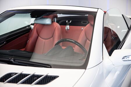 Luxury convertible car with red leather seatsの写真素材
