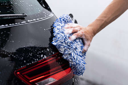 Cleaning modern car with active foamの写真素材