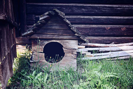 Empty old wooden dog houseの写真素材