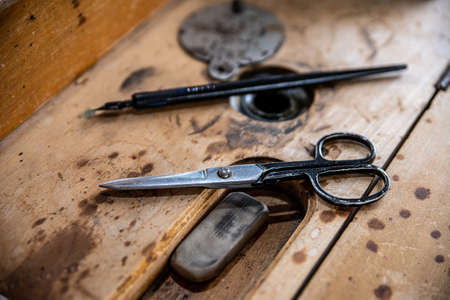 Old vintage scissors in tailor workshop.