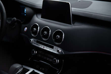 Modern car multimedia screen and dashboard with car air condition control panelの写真素材