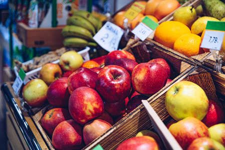 A stand of fresh fruit in the store.