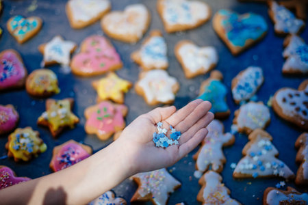 Gingerbread decorations. Christmas gingerbread cookies with tasty colorful sugar.の写真素材