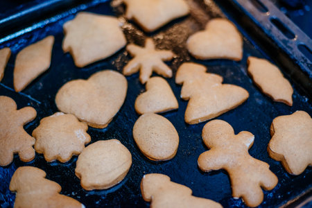 Gingerbread dough on baking sheet during baking making cookies.の写真素材