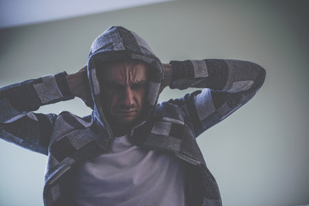 Depression and hopelessness. Sad and desperate man holding his head.