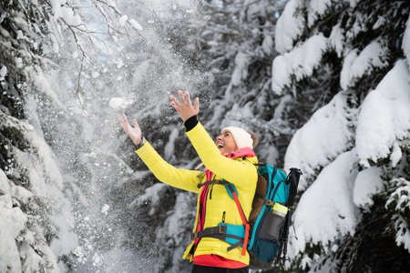 Happy tourist in a beautiful winter landscape.の写真素材