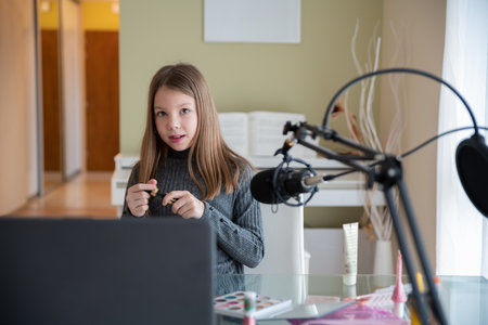 A young beauty blogger records online video content, live broadcasting of beauty products.の写真素材