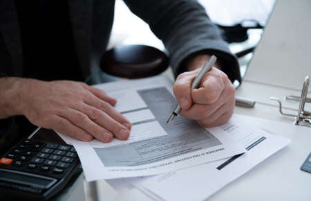 Man sign document with bankruptcy letters. Bankruptcy notification.の写真素材
