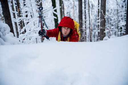 Mountain climbing. Effort on the face of a climber while climbing.の写真素材