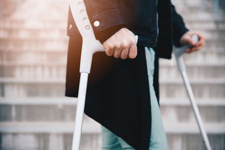 Close up of man using crutches. Disability.の写真素材