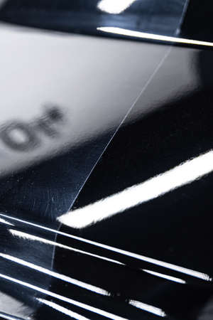 Before and after effect after car varnish polishing in car detailing studio.