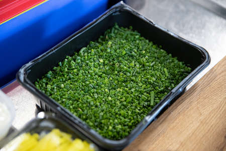 Cut fresh green chive in a boxの写真素材