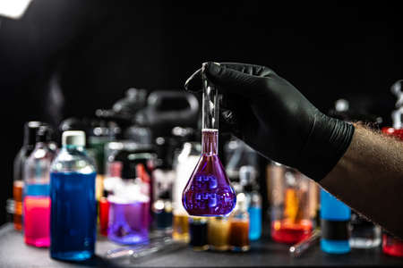 Chemist laboratory with different sorts of coloured chemical liquids