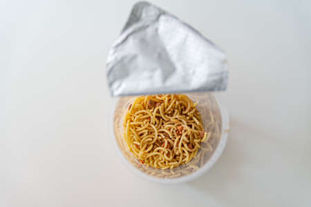 Instant noodles view from above. Instant noodles with flavoring powder and seasoning oil.の写真素材