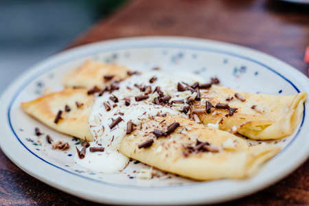 Pancake with cottage cheese, topped with creamの写真素材