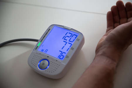 Man checking blood pressure. Health and medicine concept.の写真素材