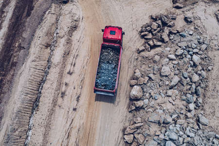 Aerial view of tipper truck at the construction site.