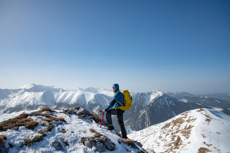 A strong, determined and active climbers success. He gets peaks in winter.の写真素材