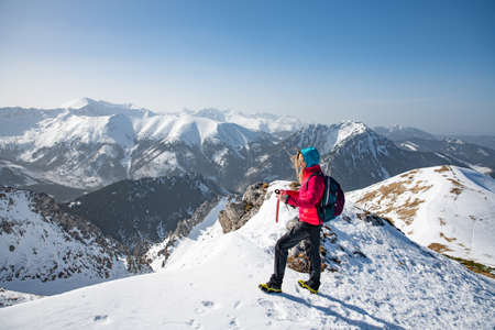Trekking and hiking inspiration and motivation in beautiful landscape. Winter mountain landscape.の写真素材