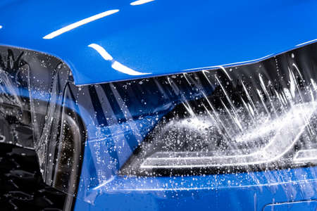 Protecting car hood with transparent ppf vinyl foilの写真素材