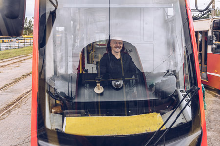 Tram driver runs the tram. Transportの写真素材