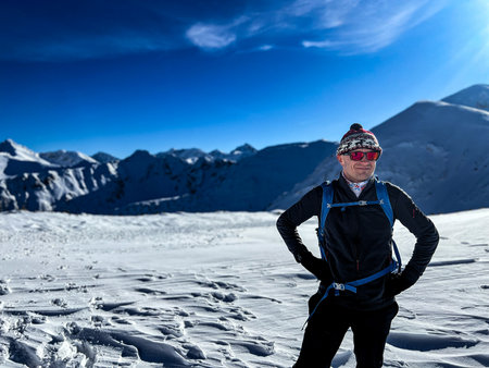 Joyful mountaineer in the snow-covered Polish Tatrasの写真素材