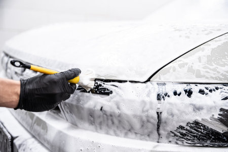 Thorough hand cleaning of car elements using a precise brushの写真素材