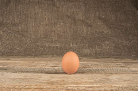 Eggs in a tray on a wooden backgroundの写真素材