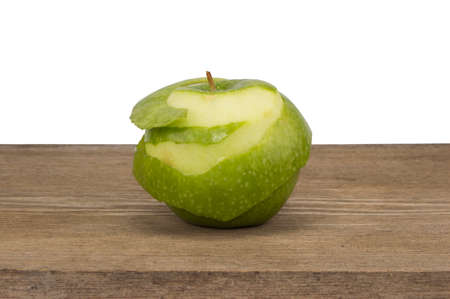 Green apple on wooden table and white backgroundの写真素材