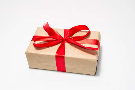 gift in box with red ribbon on a white backgroundの写真素材
