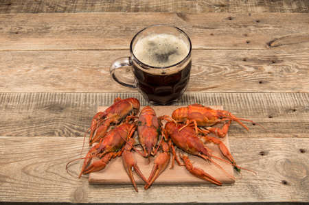 beer and boiled crawfish on the tableの写真素材