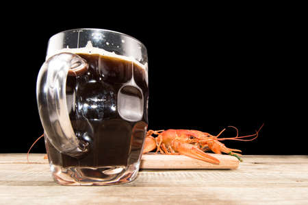 beer and boiled crawfish on the tableの写真素材
