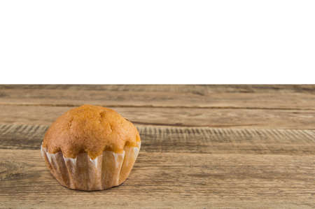 small cake on wood table, white backgroundの写真素材