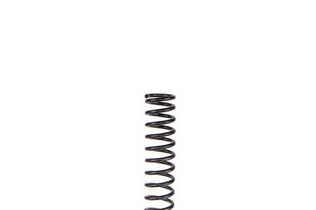 black old twisted spring on a white backgroundの写真素材