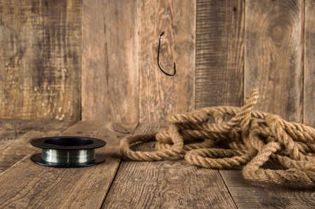 fishing hook on a wooden backgroundの写真素材