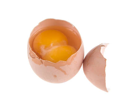 egg and two yolks on isolated white background